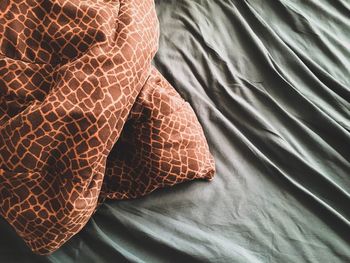 Close-up of lying down on bed at home