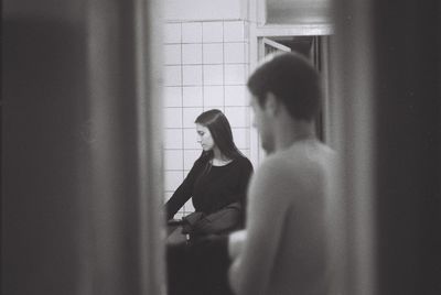 Man standing in corridor