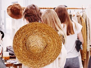 Rear view of woman standing in store