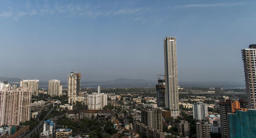 Modern buildings in city against sky