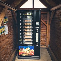 Snacks in vending machine in wooden cabin