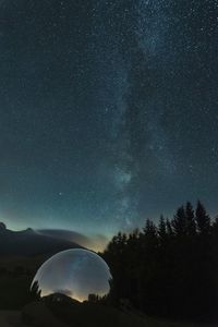 Scenic view of star field against sky at night