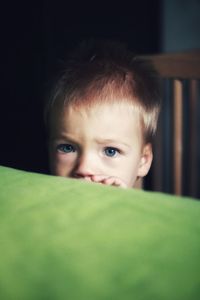 Close-up portrait of blonde baby boy at home