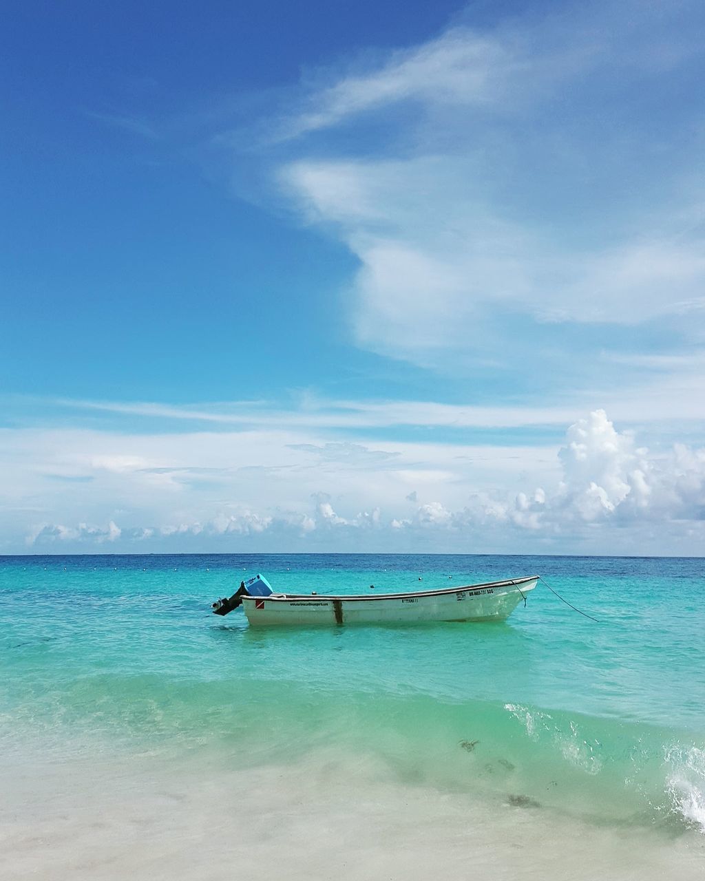 sea, water, sky, horizon over water, beauty in nature, scenics, cloud - sky, nature, beach, nautical vessel, transportation, tranquility, mode of transport, tranquil scene, outdoors, day, sand, outrigger, longtail boat, jet boat, no people