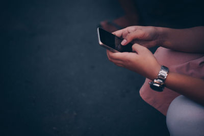 Close-up of woman using mobile phone