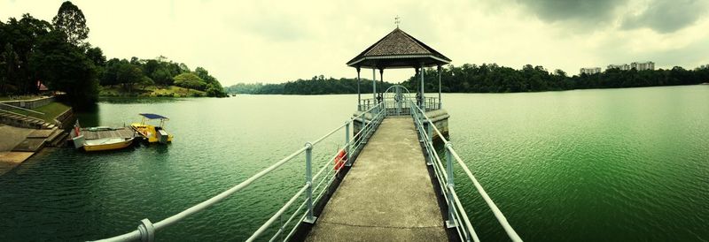 View of pier leading towards sea