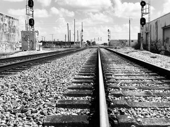 High angle view of railroad tracks against cloudy sky