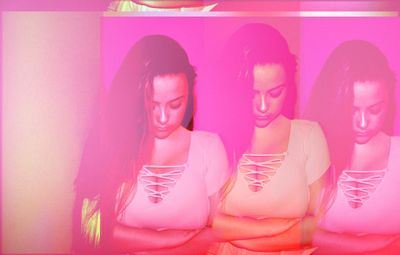 Group of people looking at pink wall