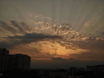 High angle view of buildings against sky during sunset