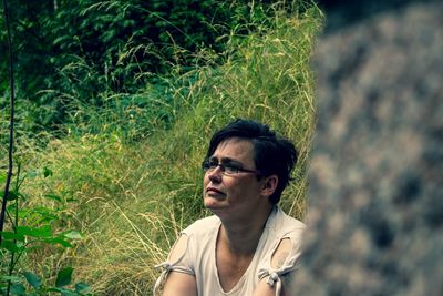 Portrait of young man wearing sunglasses outdoors