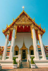 Low angle view of temple against building