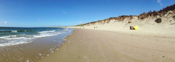 Scenic view of beach against clear sky