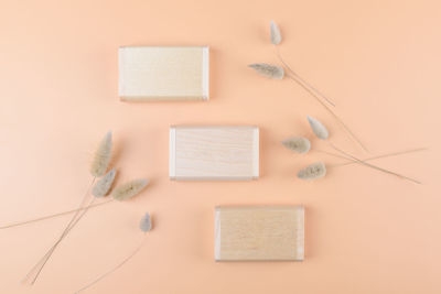 Directly above shot of beauty products on pink background