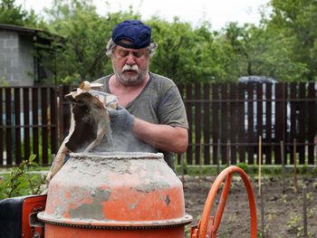 Mid adult man in yard