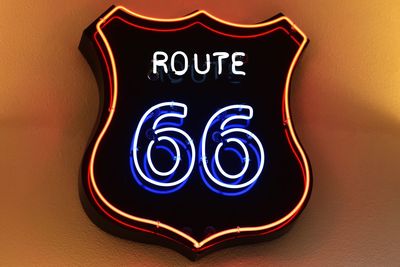 Close-up of illuminated text on wall