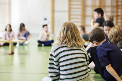 Children having class in school gym