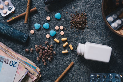 High angle view of medicine and tobacco product on table