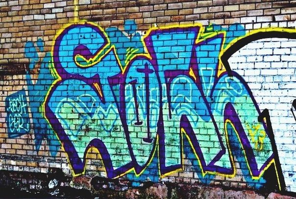 graffiti, art, built structure, art and craft, architecture, creativity, wall - building feature, building exterior, text, human representation, multi colored, western script, blue, communication, street art, wall, brick wall, mural, day, pattern