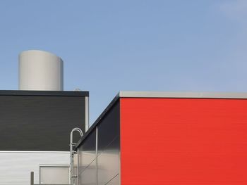 Low angle view of building against clear blue sky