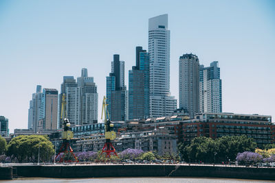 Buildings in city against sky