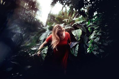 Young woman standing in park