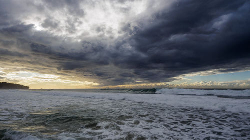 Scenic view of landscape against cloudy sky