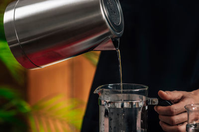 Pouring water in french press pot