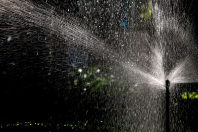 Blurred motion of water splashing on grass