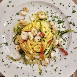 Directly above shot of pasta served on table