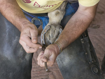 Midsection of man working