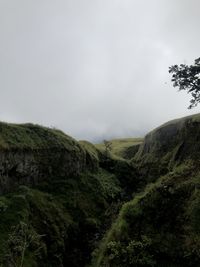 Low angle view of rock formations against sky