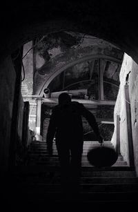 Low angle view of woman standing in front of building
