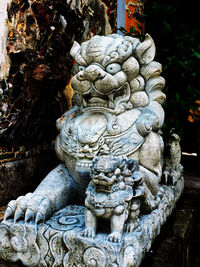 Statue of buddha against temple