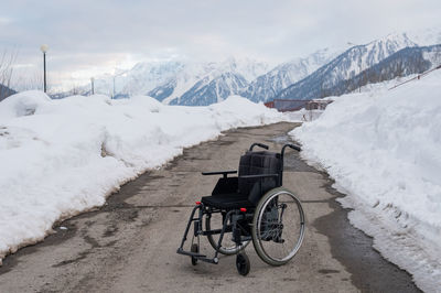 Bicycle on snow covered mountain