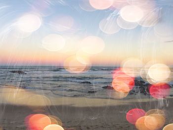 Close-up of sea against sky during sunset