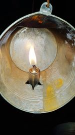Close-up of lit candle