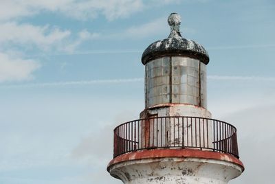 High section of tower against sky