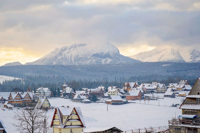 Scenic view of snowcapped mountains against sky during winter