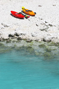 High angle view of red rock in sea