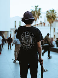 Rear view of man standing on street