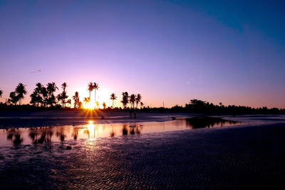 Scenic view of sunset over lake