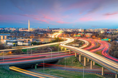 High angle view of light trails on highway in city