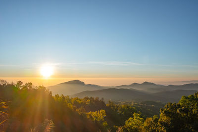 Scenic view of mountains against sky during sunset