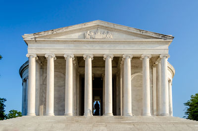 Low angle view of historical building against blue sky