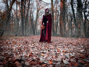 Rear view of woman standing on field