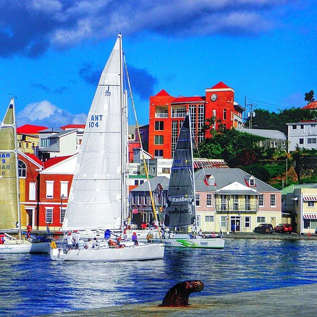 building exterior, architecture, built structure, water, sky, waterfront, nautical vessel, city, cloud - sky, boat, cloud, residential building, transportation, canal, building, mode of transport, incidental people, residential structure, blue, river