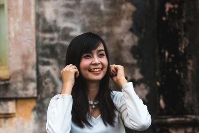 Cheerful young woman looking away