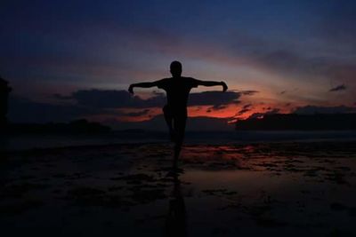 Silhouette of people at sunset