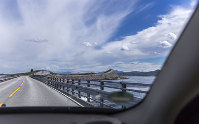 Road seen through car windshield