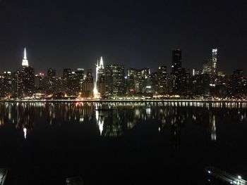 Reflection of illuminated buildings in water at night